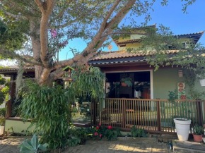 Casa com 4 suítes perto da praia